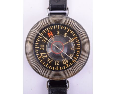 WW2 Luftwaffe Wrist Compass, being a liquid filled example made by Kadlec. Black bakelite casing is stamped with various issu
