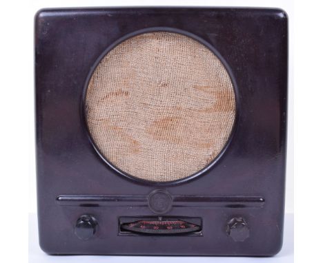 WW2 German Peoples Radio (Volksempfanger), in brown bakelite plastic with the original speaker covering. Eagle and Swastika m