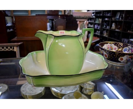An Art Deco Royal Winton green glazed pottery jug and basin,&nbsp;basin 48cm wide, the jug 27.5cm high. 