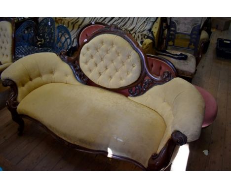 A Victorian carved walnut and button upholstered settee,&nbsp;with matching armchair. 