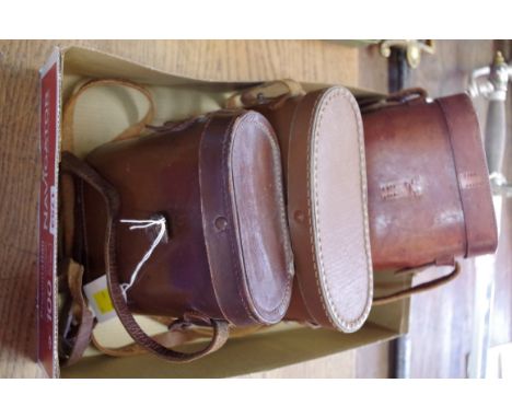 A pair of Kershaw binoculars,&nbsp;with broad arrow stamp; together with two further pairs of vintage field glasses, each cas