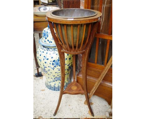 An Edwardian mahogany and inlaid tripod jardiniere&nbsp;stand,&nbsp;92cm high. 