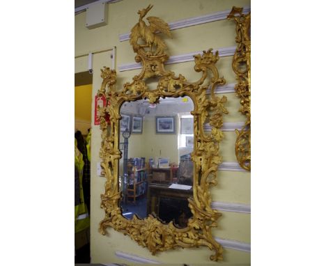 A good 18th century carved and giltwood pier mirror,&nbsp;with hoho bird finial, 143 x 80cm. 