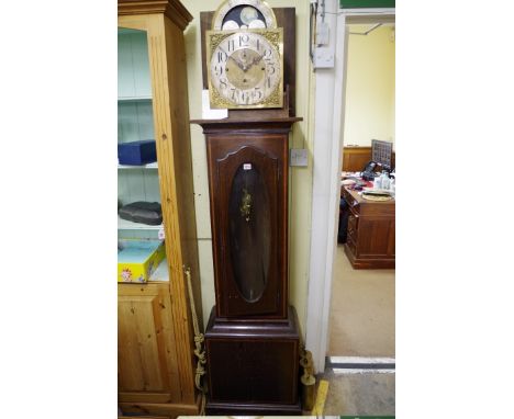 An early 20th century oak and satinwood banded eight day musical longcase clock, the 12in brass dial inscribed 'HWN, Baden' w