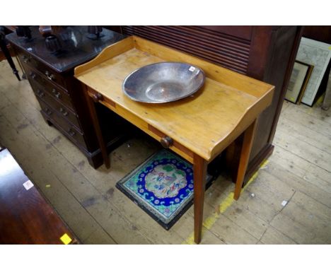 A 19th century South African yellow wood and hardwood wash stand,&nbsp;90.5cm wide, with plated copper basin.&nbsp; 
