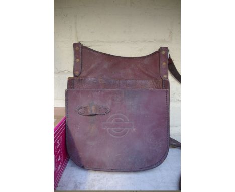A vintage brown leather London Transport bus conductor's bag, by 'Peter Jones, Abergavenny'; together with a vintage 'CRS Lon