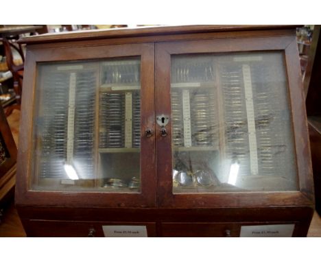 A circa 1900 oak optometrist's lens display box,&nbsp;with testing lenses,, 158cm wide.&nbsp; 