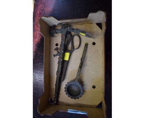 An Islamic brass ceremonial axe;&nbsp;together with a similar spoon; and a pair of scissors.&nbsp; 