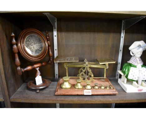 An antique turned wood small shaving mirror,&nbsp;28cm high; together with a pair of postage scales. 