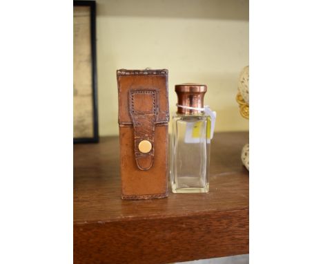 A leather cased scent flask,&nbsp;with enamel inset lid, the flask 11.5cm high. 