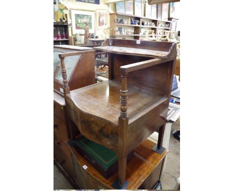 A 19th century mahogany serpentine fronted commode chair.&nbsp; 
