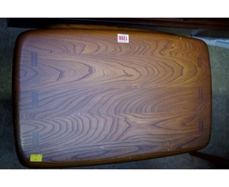 A nest of three Ercol elm tables, largest 57cm wide.&nbsp; 