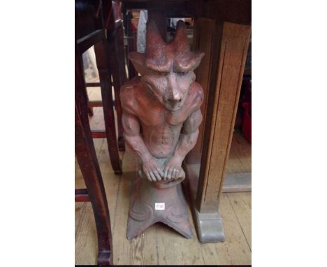A roof ridge gable end tile,&nbsp;surmounted with a devil, 71cm high. 