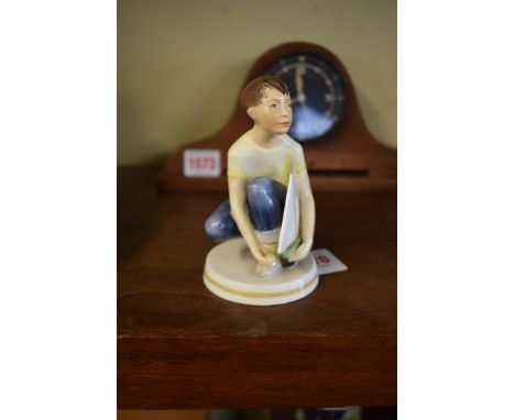 A rare Royal Worcester 'Master Mariner' figure, from the Playtime Series, with yellow t-shirt and blue trousers, 11.5cm high.