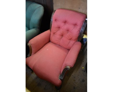 A Victorian carved oak and button upholstered occasional armchair.&nbsp; 