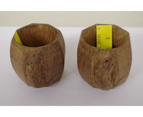 Two Robert Mouseman Thompson carved oak octagonal napkin rings. 