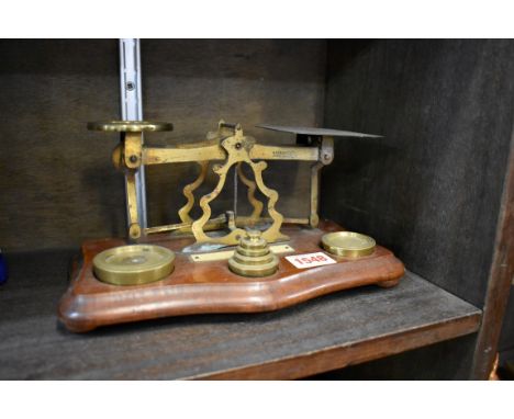 A set of postage scales and weights.&nbsp; 