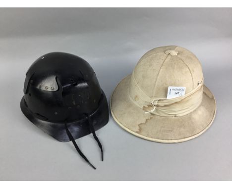 PITH HELMET BY BAY EASTERN HELMET CO., along with another helmet (2)