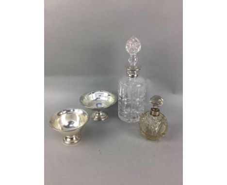 SILVER CIRCULAR STEMMED BONBON DISH, stamped PrIzener Sterling weighted, along with another, a silver collared decanter, and 