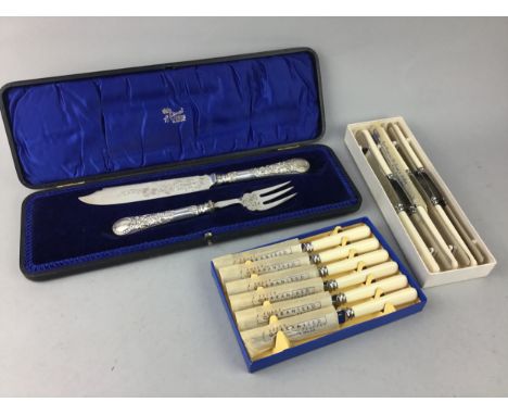 SILVER PLATED BREAD KNIFE AND FORK, in fitted case, along with other cased cutlery