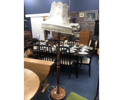 STAINED WOOD STANDING LAMP, on circular base, with shade, 185cm high overall