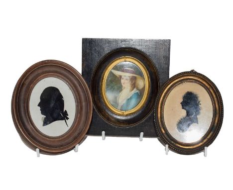 A Profile Silhouette Portrait on Glass, Mrs Hext of Trenarren, Cornwall, facing to dexter, on glass, in a period gilt metal g