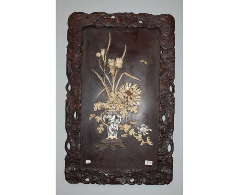 A Japanese Meiji period ivory and mother of pearl shibayama wall plaque depicting an ikebana study of peonies and iris, 73cm 