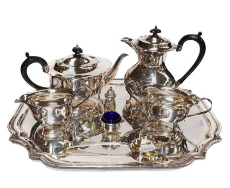 A plated tray, four-part plated tea service, silver George III berry spoon, silver salt and pepper