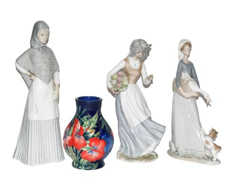 A Lladro figure, two similar figures, a quantity of Royal Ashmore figures of ducks and rabbits, a box Old Tupton ware vase
