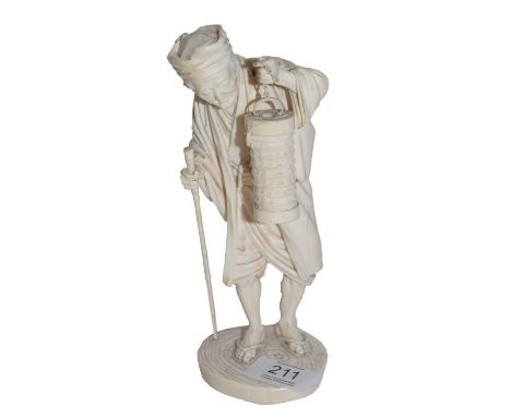 An early 20th century Japenese ivory okimono of an old man carrying a lantern, bearing two character mark to base, 19cm highC