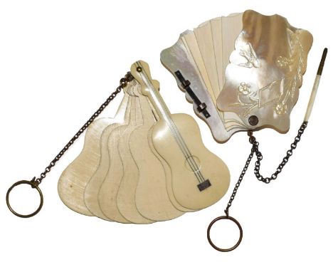 Two Victorian Aide Memories one shaped oblong with mother-of-pearl covers and ivory tablets, one cover carved with foliage an