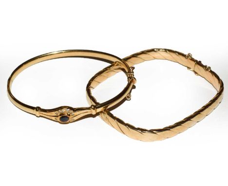 A sapphire and diamond hinged bangle, stamped '375', inner measurements 6cm by 5cm; and a TV shaped bangle, stamped '9K', inn