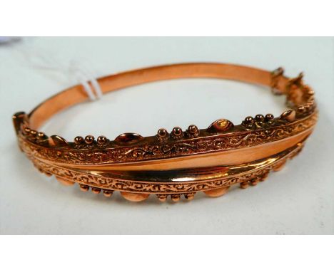 A 9 carat gold hinged bangle, inner measurements 6.1cm by 4.9cmCondition report: Gross weight 8.2 grams.