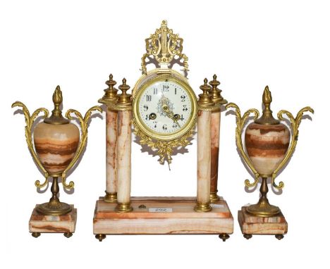 An early 20th century French onyx and gilt metal clock garniture, striking on a bell