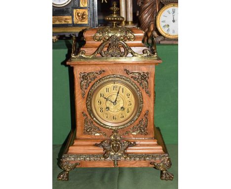 An oak and gilt metal mounted striking mantel clock, circa 1890, twin barrel movement striking on a gong, 44cm high