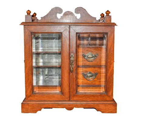 A tabletop cabinet/games compendium, with bottom draw fitted with a cribbage board and a set of dominoes