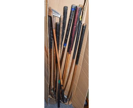A group of vintage hickory shafted golf clubs