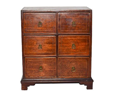 A 19th century inlaid mahogany apprentice chest of six drawers, raised on bracket feet 