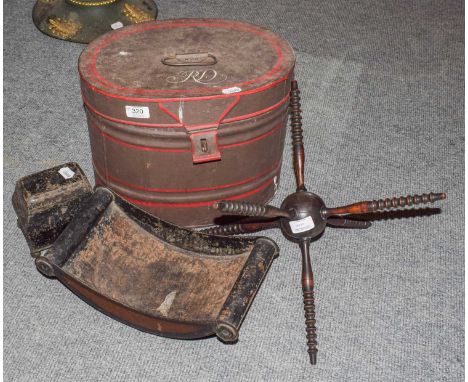 A quantity of 19th century toleware items including a hatbox, cheese coaster and a tea caddy; together with a wool winder (4)