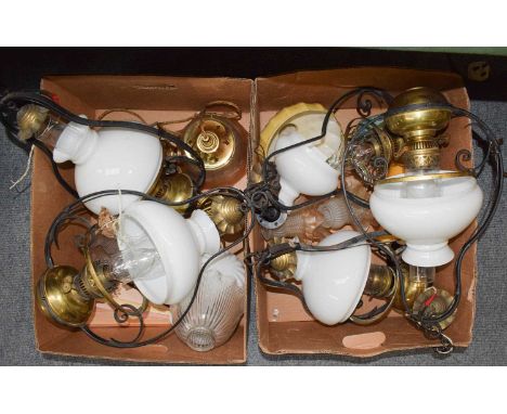 Assorted early 20th century and later lighting including an Edwardian brass rise and fall ceiling light, five hanging oil lam