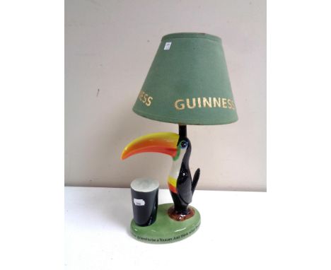 A Carlton ware Guinness toucan table lamp with shade  