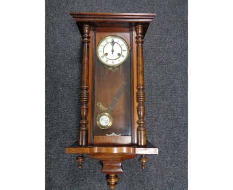 A 20th century Junghans eight day wall clock with brass and enamel dial 