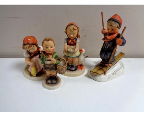 Four West German Hummel figures to include Be Patient, Skiing Boy etc
