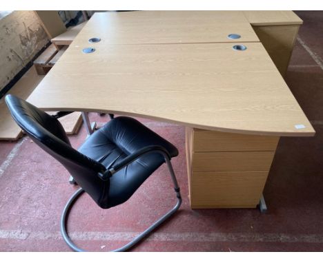 A light oak effect desk, width 140 cm, together with three chest and black leather chair. (3)