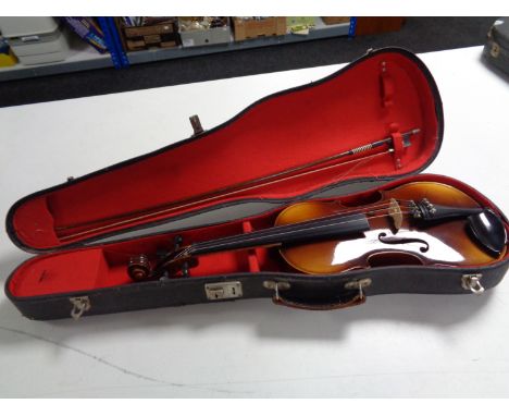 A Stradivarius copy violin and bow in hard case 