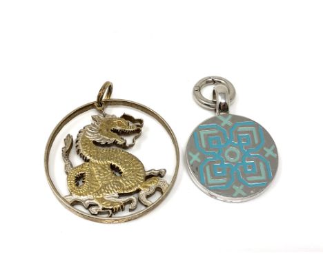 A sterling silver and enamel pendant together with a fine silver gilt pendant. (2)