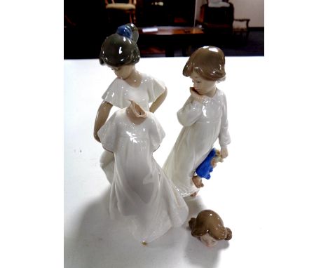 Three Nao figures  CONDITION REPORT: One damaged.