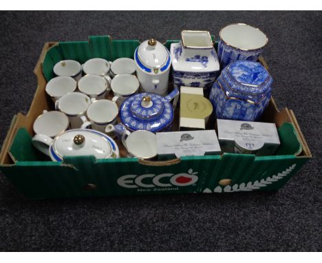 A box of Ringtons china, Centenary caddy, teapot and mugs, Cathedral tea caddy, willow pattern vase etc