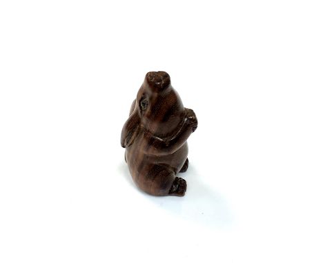 A carved Chinese hardwood netsuke - Wild rabbit seated 