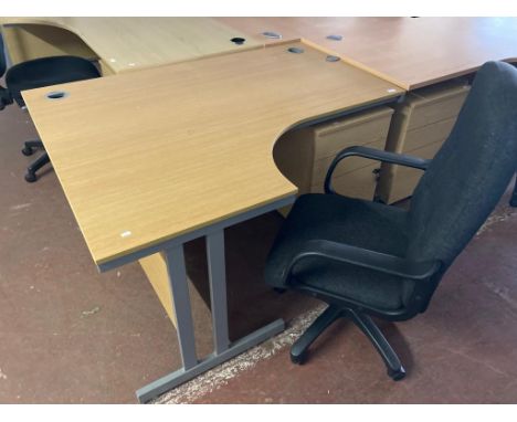 A light oak effect desk, width 145 cm, together with three drawer chest and black swivel armchair. (3)